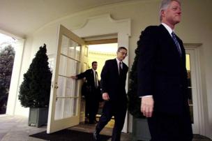 Doug Band and John Podesta leave the oval office on Bill Clinton's last day as president