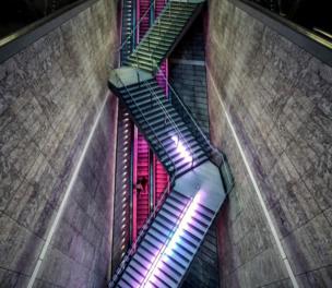 Suspended stairs and an escalator