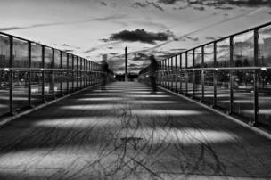 Two men on a bridge
