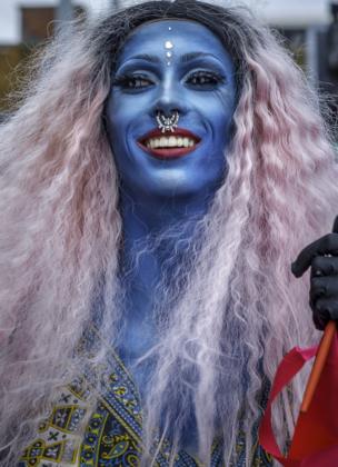A man with his face painted blue