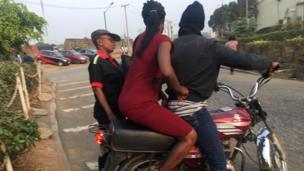 woman on motorcycle taxi