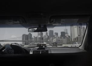 A view of New York City skyline seen through a car window