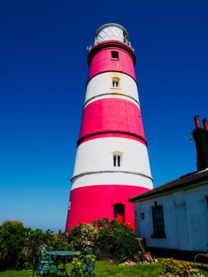 A red and white striped lighthouse