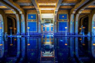 A swimming pool with mosaic decorations
