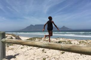 Boy running to the beach