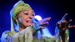 Esma Redzepova performs in Switzerland in 2006, dressed in a bright green turban