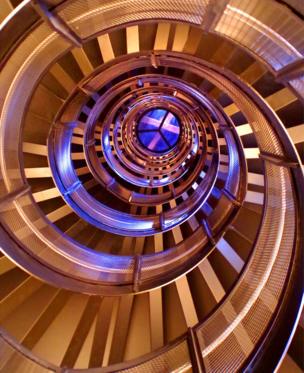 A view looking up at a large spiral staircase