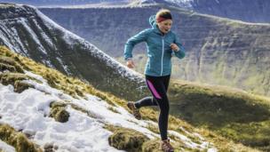 woman running in mountains