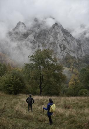 People walking near mountains