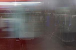 An underground train passes by in a blur