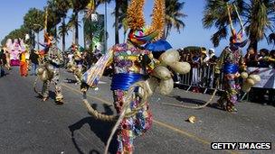 Revelers dressed as devils perform in a carnival parade in Santo Domingo