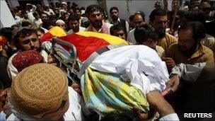 Supporters carry the body of Habib Jalib in Quetta on July 14, 2010