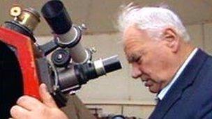 Patrick Moore looks through his own telescope