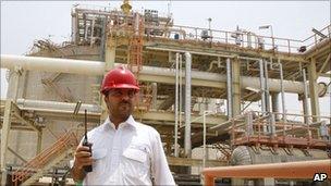 An Iranian worker stands in front of the partially constructed site which is part of South Pars gas field. Photo: July 2010