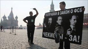 A Yabloko opposition activist holds a poster condemning the new law on Red Square, 26 July
