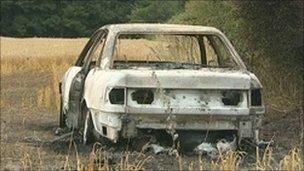 Burnt out getaway car used in raid on jewellers