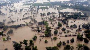 Houses are submerged in flood waters in Sanawan near Multan in central Pakistan