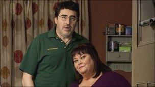 ALFRED MOLINA as Roger and DAWN FRENCH as Val