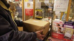 Parcel being weighed at a Post Office counter