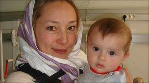 Dr Karen Woo holds a baby at the French Medical Institute for Children in Kabul (Photo: Firuz Rahimi)