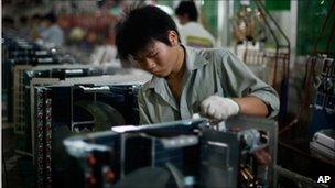 Worker on a production line of air conditioners at a factory in Zhuhai in south China's Guangdong province