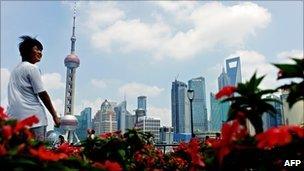 File image of tourist looking at the Bund in Shanghai