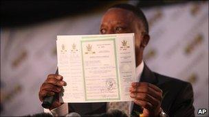 Abbey Chikane of Kimberley Process shows the certificate awarded to Zimbabwe