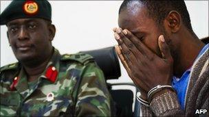 One of the suspects weeps at a press conference given by the Ugandan military on 12 August 12 2010