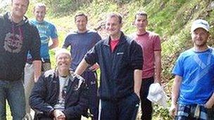 Martin Williams in his wheelchair with supporters who will carry him up Snowdon
