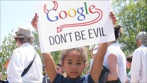girl with Google don't be evil sign