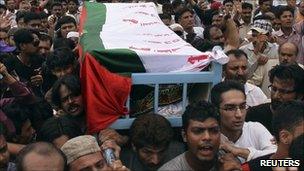 Supporters carry the coffin of Raza Haider after he was shot dead in Karachi
