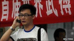 Man talks on mobile phone in central Beijing