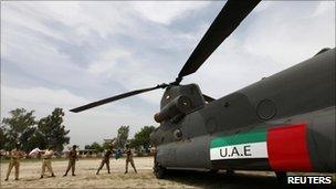 Pakistani soldiers unload supplies from a United Arab Emirates helicopter in Alipur, Muzaffargarh district, Punjab province - 19 August 2010