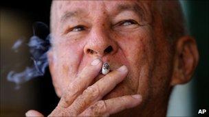 A man smokes a cigarette in Havana - 25 August 2010
