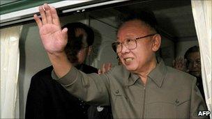 Kim Jong-il waves from a train leaving Beijing on 7 May 2010
