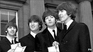 Beatles receive their MBEs in 1965