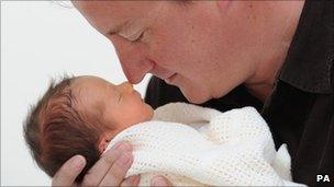 David Cameron holding his baby daughter, Florence Rose Endellion Cameron