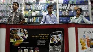 Indian salesmen at a mobile store in Hyderabad, India