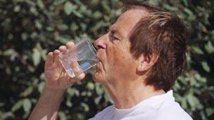 man drinking water