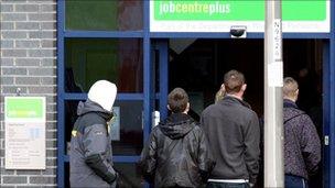 Young people outside a job centre