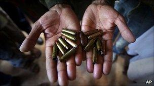 A Kashmiri mourner shows empty cartridges allegedly fired by government forces at protesters on the outskirts of Srinagar, India on Monday 13 September 2010