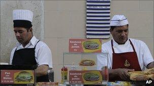 Canteen workers prepare sandwiches in Havana, Cuba