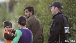 Police evacuate a Roma family from an illegal camp in Villeneuve d'Ascq, northern France, 24 Aug 10