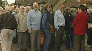 People queuing at polling station
