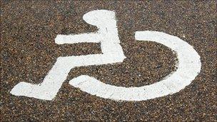 A disabled sign on a road