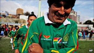 Bolivian President Evo Morales leading his team onto the pitch