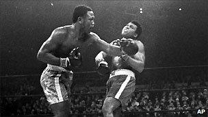 Joe Frazier hits Muhammad Ali in their heavyweight title fight in Madison Square Garden in 1971