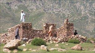 Turi tribesmen building a house of rocks in Parachinar area