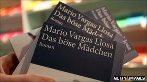 Copes of the German translation of Vargas Llosa's 2006 work - Travesuras de la Nina Mala, translated in English as The Bad Gir - on display at the Frankfurt book show