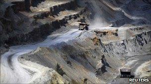 Tipper trucks transport a load at the copper mine plant in Serbian town of Bor